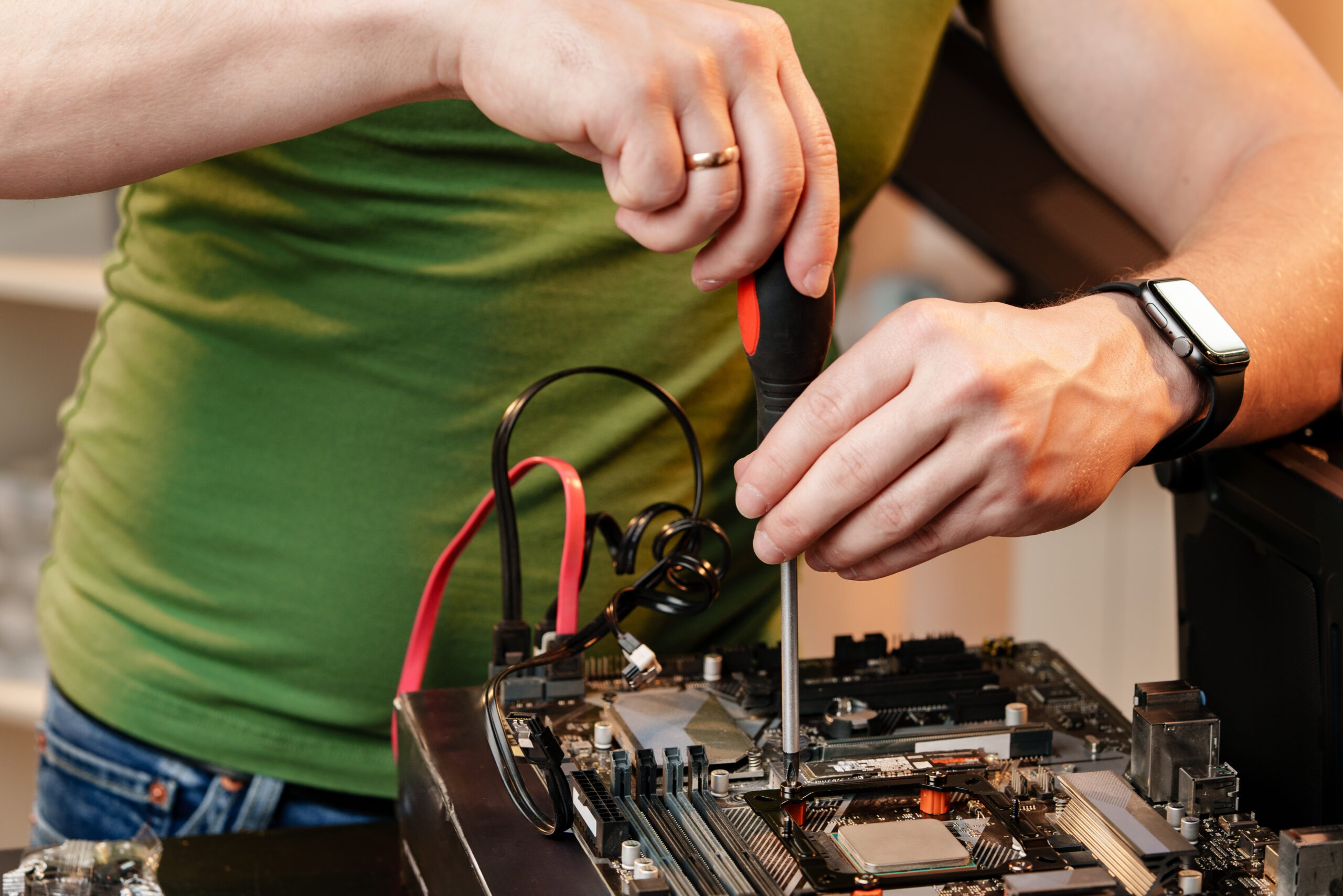 Close up of man repairing computer system unit at home